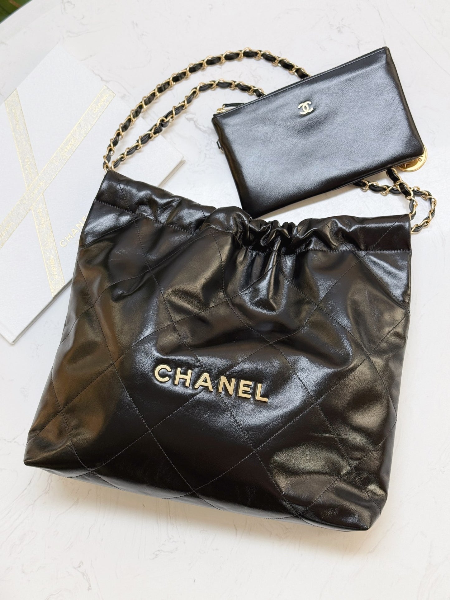 Chanel's new 22S classic diamond quilted and leather chain shoulder strap shopping bag